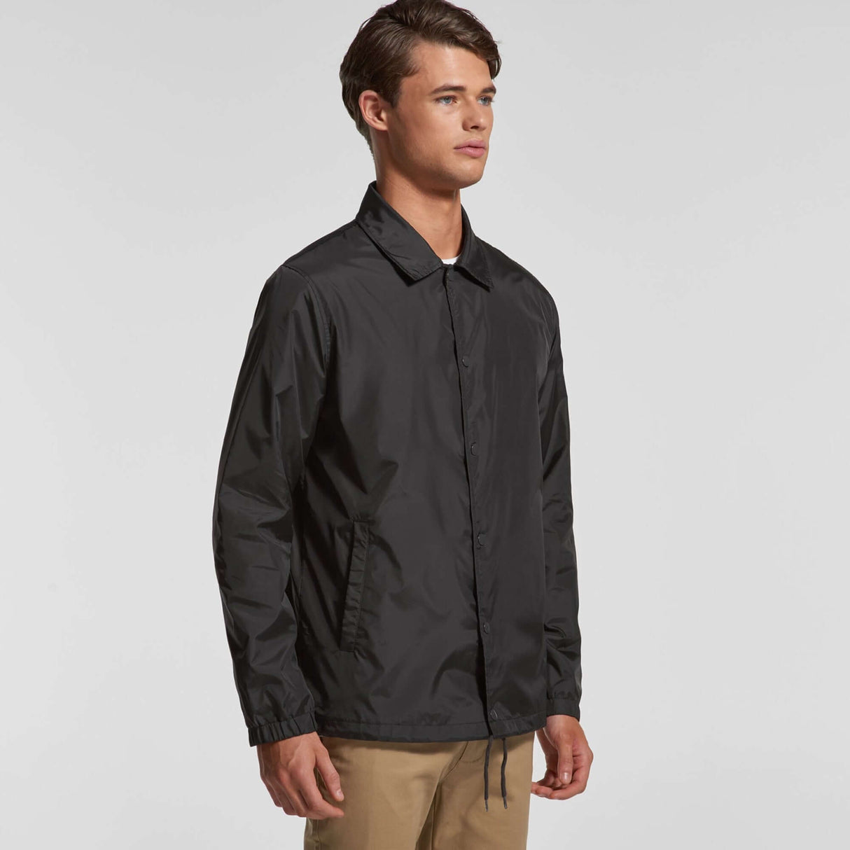 Black Cape Kings customisable coach jacket side picture with man wearing tanned chinos