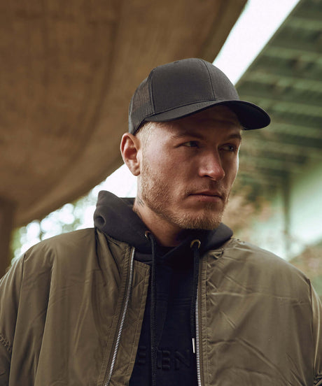 Man wearing Cape kings Customisable Premium Trucker Cap